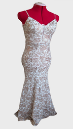 White with gold sequins floral design dress on a mannequin against a white background